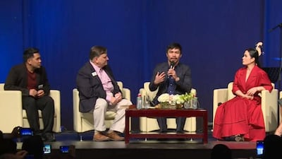 Boxer Manny Pacquiao talks during a special Fellowship church service held at Jumeirah Madinat Arena. The boxing legend and Filipino Senator was interviewed by Pastor Jim Burgess about the difference God has made in his life, family, and career. Screengrab via Youtube Live