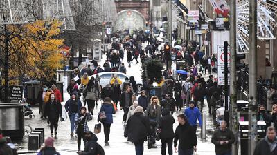 Shoppers walk down Buchanan Street on November 18 in Glasgow, Scotland. Getty Images