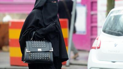 A woman wearing a niqab as she walks in a street in the center of Roubaix, northern France. France was one of the first countries to ban face veils (AFP PHOTO / PHILIPPE HUGUEN)