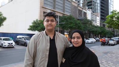 Real estate broker Yasmin Mohammed lives with her son Mohammed on the 31st floor of the Downtown Dubai building hit by fire. All pictures: Ruel Pableo / The National