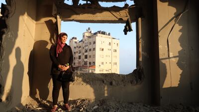 The sister of Palestinian prisoner Kamal Jouri inspects her room after it was destroyed during an overnight raid in the West Bank city of Nablus, on June 22. EPA