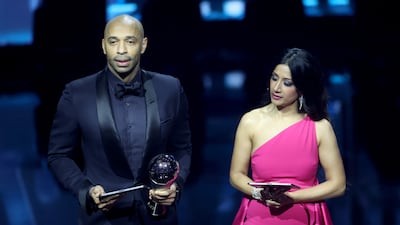 Awards show hosts Thierry Henry and Reshmin Chowdhury announce Lionel Messi as the winner of the Best Fifa Men's Player in London. Messi was not present at the ceremony, with his award collected instead by Henry. EPA