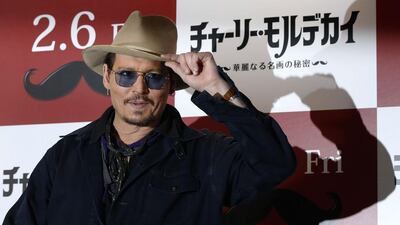 Actor Johnny Depp poses during a photo session ahead of a news conference for his movie Mortdecai in Tokyo January 28, 2015. Reuters