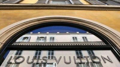 A Louis Vuitton sign sits on the window at the company's boutique on Via Dei Condotti in Rome, Italy, on Wednesday, March 9, 2011. LVMH Moet Hennessy Louis Vuitton SA Chief Executive Officer Bernard Arnault said his company's purchase of Bulgari SpA is "a step change" for its jewelry and watch unit. Photographer: Chris Ratcliffe/Bloomberg *** Local Caption *** 817090.jpg