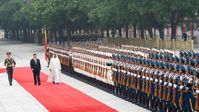 Sheikh Mohamed bin Zayed, Crown Prince of Abu Dhabi and Deputy Supreme Commander of the Armed Forces (3rd L) and Xi Jinping, President of China (2nd L), inspect the Guard of Honour during a reception, at the Great Hall of the People in Beijing, China on July 22, 2019. Rashed Al Mansoori / Ministry of Presidential Affairs