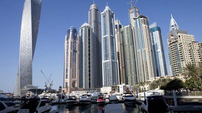 Cayan Tower, far left, which features a 90-degree twist, has been named one of the world’s top recently completed skyscrapers. Razan Alzayani / The National