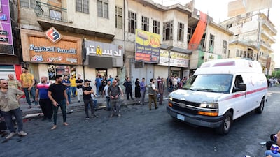 An ambulance rushes to carry wounded protesters away from the demonstrations. EPA