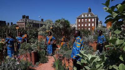 Members of the Ghanaian Methodist Fellowship Choir view the World Child Cancer's Nurturing Garden. Reuters
