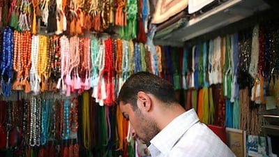 A shop in Tehran sells prayer beads imported from China. Newsha Tavakolian / The National