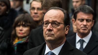 French president Francois Hollande attends the unveiling a commemorative plaque in front of the Comptoir Voltaire cafe on Boulevard Voltaire in Paris November 13, 2016, during a ceremony marking the first anniversary of the Paris terror attacks. Christophe Petit Tesson / AFP