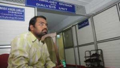 Aqeel Ahmad, a victim of the Union Carbide gas leak in Bhopal, awaits dialysis treatment at Peoples Hospital.
