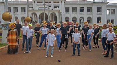 Marie Madeleine Wafo, left, founder and president of the Cameroon Association of Albino Women, with a group of young people with albinism.