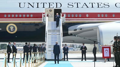 Turkish President Recep Tayyip Erdogan (C, bottom) welcomes US President Donald Trump (up) upon his arrival on Air Force One at Etimesgut Air Base near Ankara, on July 7, 2026, as he travels to attend the 36th NATO Heads of State and Government Summit. (Photo by SAUL LOEB / AFP)