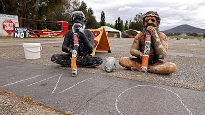 Statues of Indigenous Australians outside the old Parliament House in Canberra. AFP