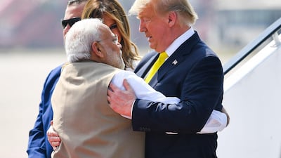 India's Prime Minister Narendra Modi embraces US President Donald Trump upon his arrival at Sardar Vallabhbhai Patel International Airport in Ahmedabad. AFP