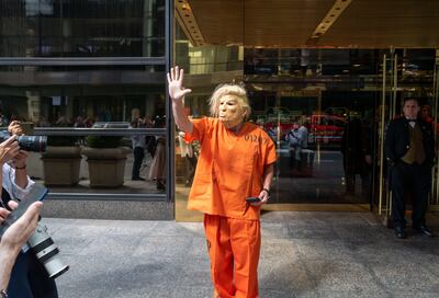 A Donald Trump impersonator walks by Trump Tower in Manhattan on August 10 in New York City. Getty / AFP