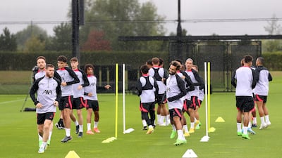 Liverpool's James Milner, front left, and Mohamed Salah, front right. PA