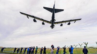 Photographers capture close-up images of a US Air Force B-52 bomber landing at RAF Fairford, Gloucestershire, on Thursday. PA