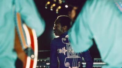 The charismatic Fela Kuti glimpsed on stage. Kuti blazed the trail for a polyrhythmic, politicised amalgam of funk, soul and African sounds. Courtesy Bernard Matussière