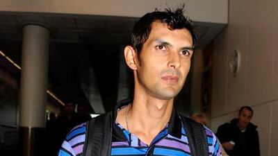 The wicketkeeper Zulqarnain Haider arrives at Heathrow airport. He plans to seek political asylum after fleeing Dubai amid alleged threats for defying a match-fixing conspiracy.