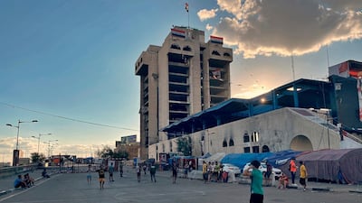 Despite a curfew imposed by the government to help fight the spread of the coronavirus, anti-government protesters play football in Tahrir Square, Baghdad, Iraq. AP Photo