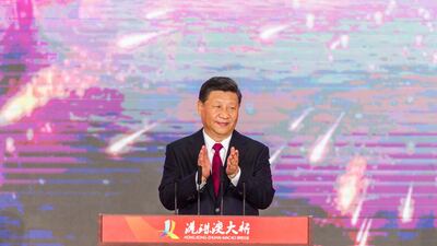 Chinese President Xi Jinping applauds during the opening ceremony. EPA