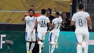 Al Hilal's Salem Al Dawsari, left, after scoring. AP