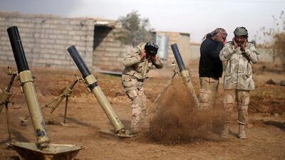 Iraqi soldiers fire mortar shells towards ISIL positions, in Shayyalah Al Imam near Mosul, Iraq on December 5, 2016. Mohammed Salem/Reuters