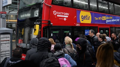 Commuters queue to board packed buses at Victoria Station as a tube strike affects the Monday morning rush hour in London. Getty Images