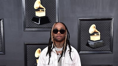 Ty Dolla $ign, wearing a snake skin jacket over leather trousers. AP