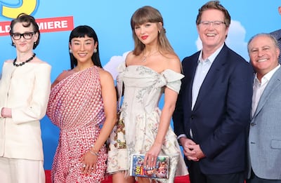 Taylor Swift with the voice cast of Toy Story 5. Getty Images