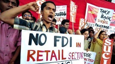 Indians protest against the government's decision to allow FDI in retail and fuel price hike in Bangalore. Jagadeesh NV / EPA
