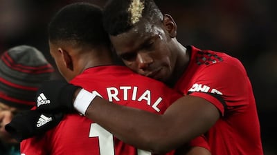 Manchester United's Anthony Martial and Paul Pogba celebrate after the match. Action Images via Reuters
