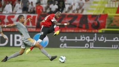 Dubai, United Arab Emirates, Oct 21, 2012, Al Ahli v Al Shabab, Al Rashid Stadium . Al Ahli's 23 Grafite (right) shoots on goal during action at Al Rashid Stadium Oct 21 2012. Mike Young / The National