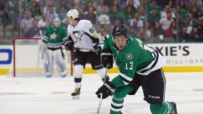 Matthias Janmark of the Dallas Stars controls the puck against the Pittsburgh Penguins in his team's NHL victory on Thursday night. Tom Pennington / Getty Images / AFP / October 8, 2015