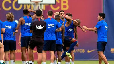 Barcelona players joke during a pre-season training session at the Joan Gamper training ground in Sant Joan Despi near Barcelona. AFP
