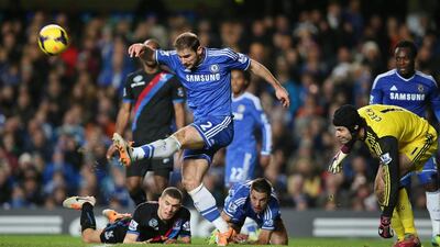 Chelsea's Branislav Ivanovic, kicks the ball clear of a goalmouth scramble, during a battle with Crystal Palace on Saturday at Stamford Bridge. Alastair Grant / AP Photo
