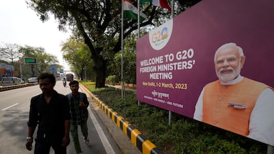 A banner with Indian Prime Minister Narendra Modi's picture welcomes delegates to New Delhi. AP