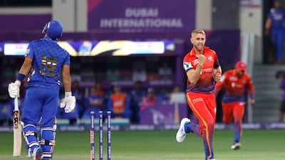 Olly Stone of Dubai Capitals celebrates the wicket of Muhammad Waseem of MI Emirates at the Dubai International Stadium