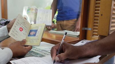 Technology is catching up with the old paper Bangladeshi passport, and expat workers are warned to beat the November 24 deadline for updating or their travel plans may have to be altered. Delores Johnson / The National