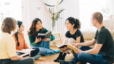 Meeting like-minded people, be that via a book club or hiking group, is one way to connect with others in a new place. Getty Images