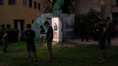 Israelis gather near a bomb shelter in Holon, central Israel, after a missile alert. AP