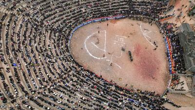 Villagers attend a bullfight in Congjiang county, Qiandongnan Miao and Dong Autonomous Prefecture, in China's south-western Guizhou province. AFP