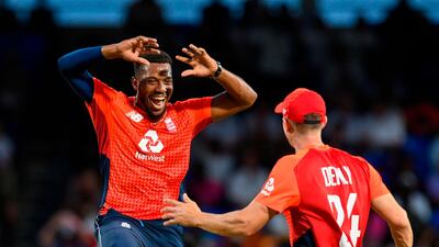 Chris Jordan (L) of England celebrates the dismissal of Fabian Allen of West Indies during the 2nd T20I between West Indies England at Warner Park, Basseterre, Saint Kitts and Nevis, on March 08, 2019. / AFP / Randy Brooks