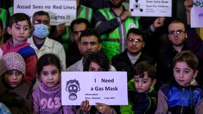 Syrian children, first aid providers and civil defence volunteers hold a gathering in Douma on April 5, 2017 to show solidarity with the victims of a chemical weapons attack in the Syrian town of Khan Sheikhoun the previous day. Mohammed Badra / EPA