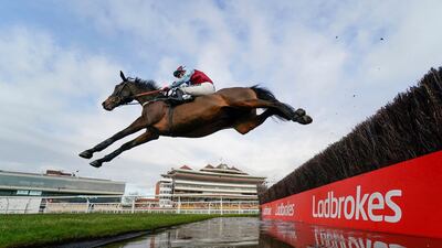 William H Bonney, ridden by Tom Bellamy, clears the water jump during the Ladbrokes Daily Odds Boosts Chase at Newbury Racecourse in England on Friday, November 27. PA