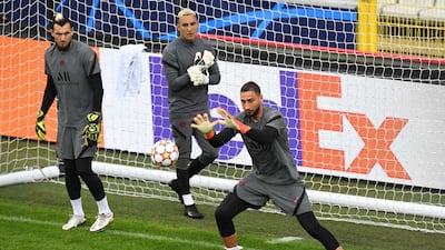 PSG goalkeeper Gianluigi Donnarumma makes a save with Keylor Navas and Sergio Rico in the background. AFP