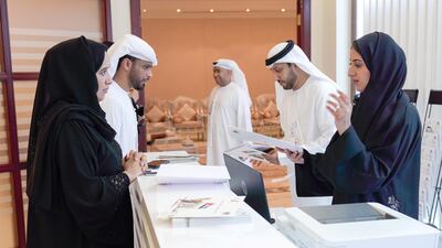 Emiratis in Abu Dhabi register themselves for this year's FNC elections. Victor Besa / The National