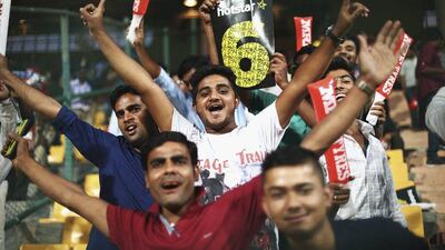 BANGALORE, INDIA - MARCH 21: Fans cheer during the ICC World Twenty20 India 2016 Super 10s Group 2 match between Australia and Bangladesh at M. Chinnaswamy Stadium on March 21, 2016 in Bangalore, India. (Photo by Ryan Pierse/Getty Images,)