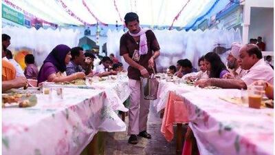 A volunteer serves food during Onam celebrations at the Kerala Social Centre in Abu Dhabi last year.